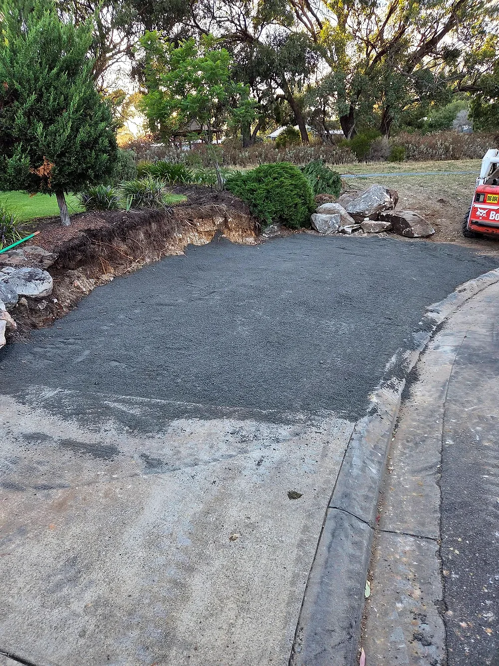 After: a full double-width driveway, graded and prepared