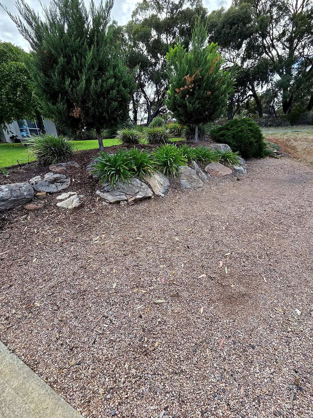 Before: a narrow single-car driveway with grass either side